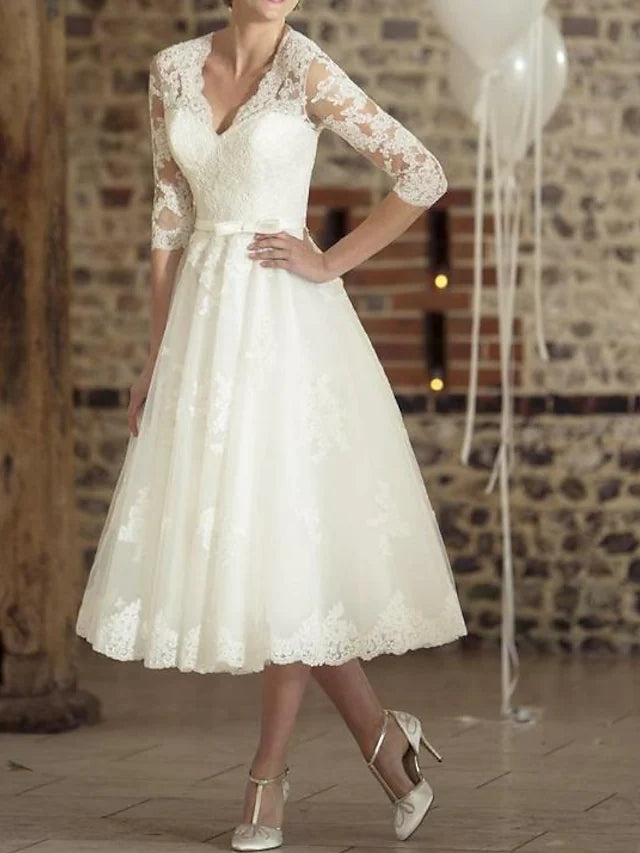 Robe de mariée A-Line longueur thé manches 3/4 décolleté en V en dentelle tulle